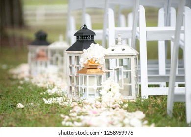 White Lanterns And White Chairs At Wedding Ceremony Isle