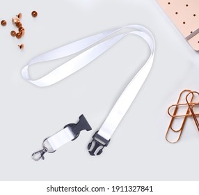 white Lanyard Neck Strap with Metal Lobster Clip and Safety Breakaway Clasp for mockup-On white desk office.