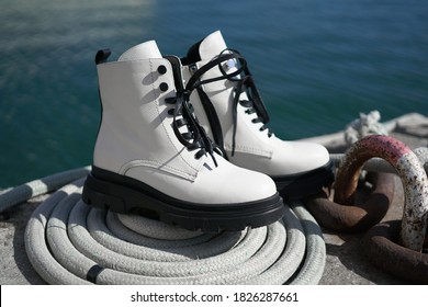 white leather boots from the new collection of fashionable shoes made of eco-leather fall-winter 2020. macro photo