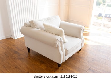 White Leather Chair By The Window. Bright Interior