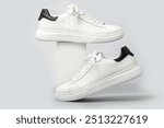 White leather sneakers isolated on gray background. Fashionable stylish sports casual shoes. Creative minimalistic layout with footwear.