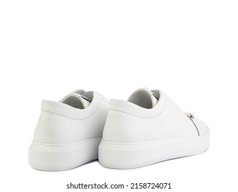 White leather sneakers with zipper in front instead of laces. Casual women's style. White rubber soles. Isolated close-up on white background. Back side view. Fashion shoes.
