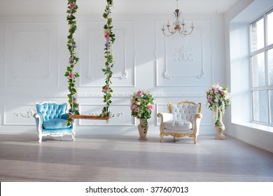 White Leather Vintage Style Chair In Classical Interior Room With Big Window And Spring Flowers