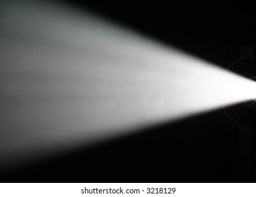 White Light Beam From Projector On Black Background