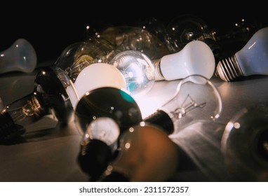 White light bulb glowing among the others. - Shutterstock ID 2311572357