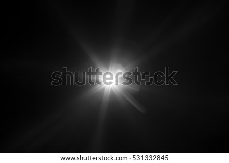 White light flare special effect in dark black background