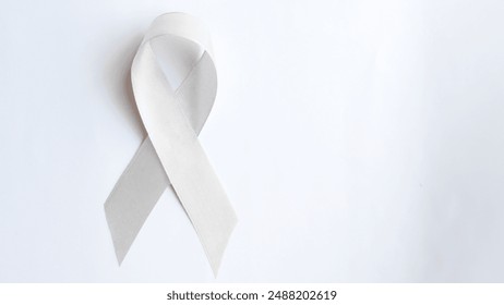 A White light pearl color ribbon for Lung cancer awareness and Multiple Sclerosis, symbol for international day of non-violence, cancer disease treatment of disease control  - Powered by Shutterstock