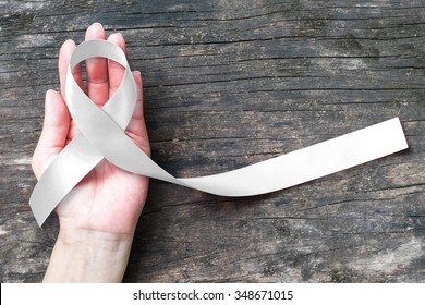 White or light pearl color ribbon for raising awareness on Lung cancer, Bone cancer, Multiple Sclerosis, Severe Combined Immune Deficiency Disease (SCID) and Newborn Screening and symbol