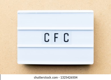 White Lightbox With Word CFC (abbreviation Of Chlorofluorocarbon) On Wood Background