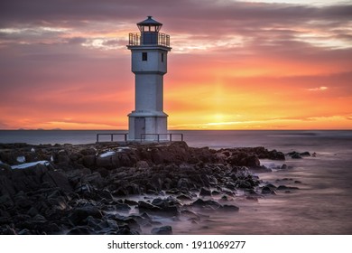 White lighthouse at the Akranes during beautiful sunset, Iceland - Powered by Shutterstock