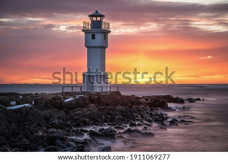 White lighthouse at the Akranes during beautiful sunset, Iceland