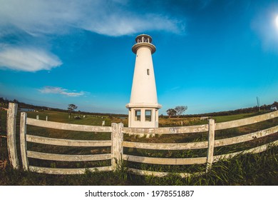 white lighthouse in the field
