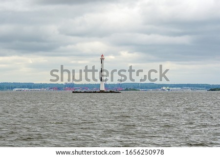 white lighthouse on the river near the Gulf of Finland in Kronstadt
