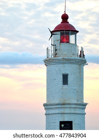 White lighthouse. Sunset