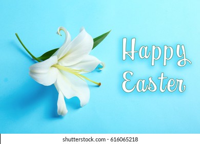 White Lily And Text HAPPY EASTER On Color Background