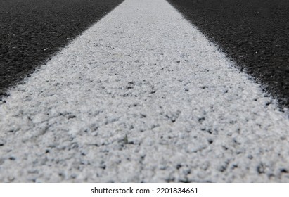 White Line Of The Asphalt Road Photographed From Below Without People