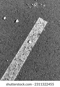 White line on asphalt road in black and white. Abstract background and texture for design. - Shutterstock ID 2311322455