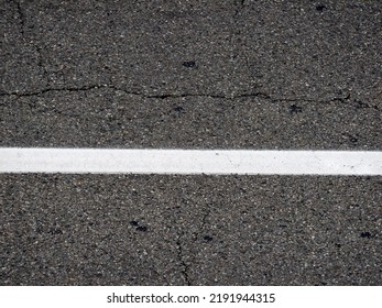 White Line Road Markings On Black Tarmac