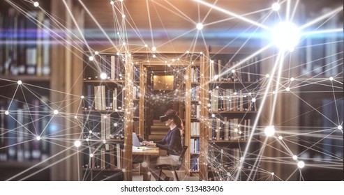 White lines on black background against side view of female student in virtual reality headset using laptop - Powered by Shutterstock