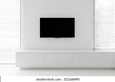 White Living Room Detail Tv On Wall With Commode And Epoxy Flooring