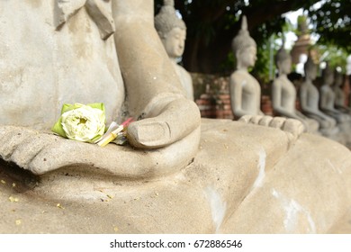 White Lotus, Joss Stick And Candle On Buddha Statue Hand At  Wat Yai Chai Mongkon. Ayutthaya Historical Park, Thailand