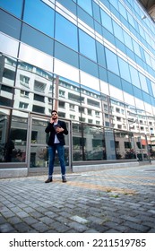 White Male Businessman With His Tablet Talking On The Phone