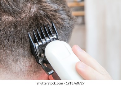 A White Male During A Fresh Shaved Hair Cut With Electric Clippers And Foils At Home In The Bathroom. 