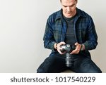 White man checking camera record