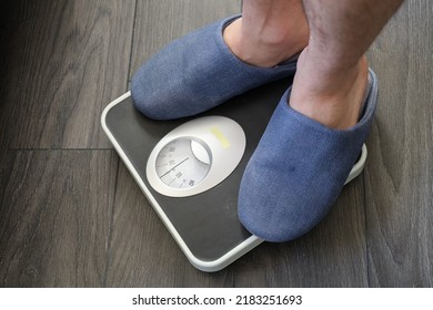 White Man Feet On Bathroom Scale , Weight Check