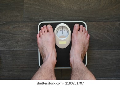 White Man Feet On Bathroom Scale , Weight Check