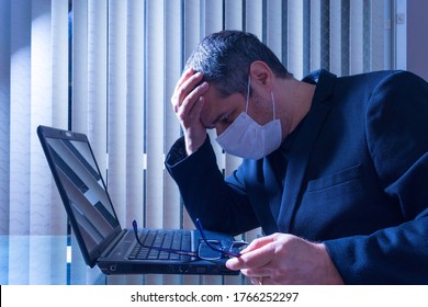 White Man With Protective Mask In Home Office New Normal, Worried, Unemployment, Hand On Head, Thoughtful, Desperate, Black Suit, Notebook