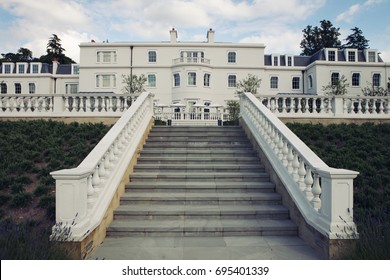 white mansion with grand staircase