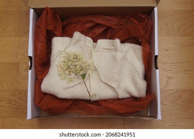 White Mantle For Children Packed In A Box With Brown Fabric