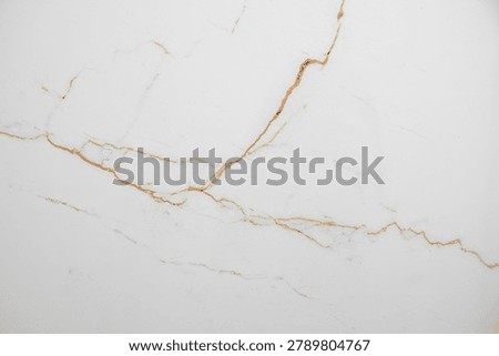 A white marble background with subtle brown veining and a natural stone texture. Concept for a luxury and elegant surface for a banner or advertising display. Top view, copy space.