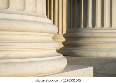 White Marble Neoclassical Columns Of The Portico Of The Supreme Court Of The United States Building In Washington DC, USA