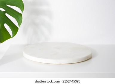 White Marble Podium For Product Presentation With Tropical Tree Leaves