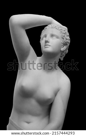 White marble sculpture head of young woman. Statue of sensual renaissance art era naked woman in circlet antique style isolated on black background