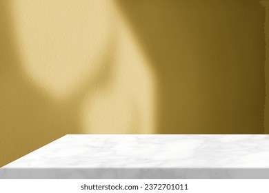 White Marble Table Corner with Shadow Buddhist Church Roof Shadow on Gold Concrete Wall Texture Background, Suitable for Product Presentation Backdrop, Display, and Mock up.
