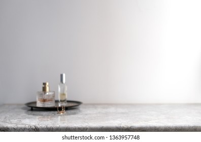 White Marble Table Top Can Used For Display Or Montage Your Products. Selective Focus Blurred White Background. Vanity Table Perfume Bottle Spray. 