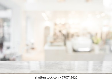 White Marble Table Top On Blur Coffee Shop Window Background. For Product Or Foods Montage.