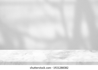 White Marble Table With Tree Branch Shadow On Concrete Wall Texture Background, Suitable For Product Presentation Backdrop, Display, And Mock Up.