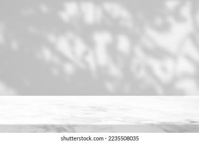 White Marble Table with Tree Branch Shadow on Concrete Wall Texture Background, Suitable for Product Presentation Backdrop, Display, and Mock up. - Shutterstock ID 2235508035
