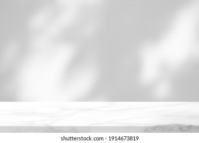 White Marble Table With Tree Shadow On Concrete Wall Texture Background, Suitable For Product Presentation Backdrop, Display, And Mock Up.