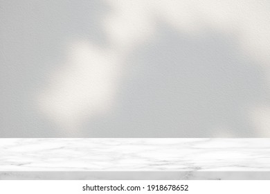 White Marble Table With Tree Shadow In The Garden On Concrete Wall Texture Background, Suitable For Product Presentation Backdrop, Display, And Mock Up.