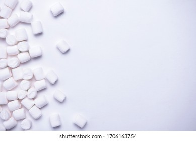 White marshmallows as background, macro. Fluffy marshmallows texture close up.