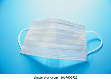 White Mask On Blue Background