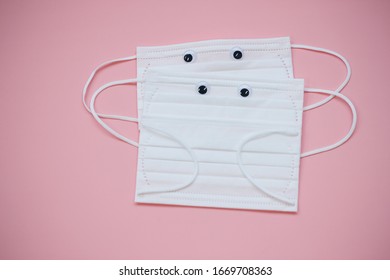 White Mask On Pink Background