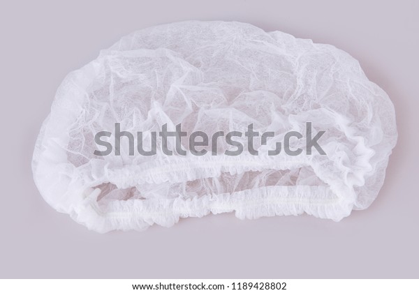 White medical\
disposable cap isolated on\
white