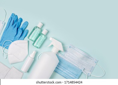 White medical masks and respirators with glove, hand sanitizer on blue background.  Face mask protection  KN95 or N95 and surgical masks for protection virus, flu, coronavirus, COVID-19.  