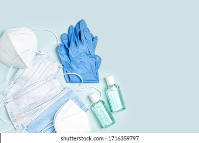 White medical masks and respirators with glove, hand sanitizer on blue background.  Face mask protection  KN95 or N95 and surgical masks for protection virus, flu, coronavirus, COVID-19.   - Powered by Shutterstock